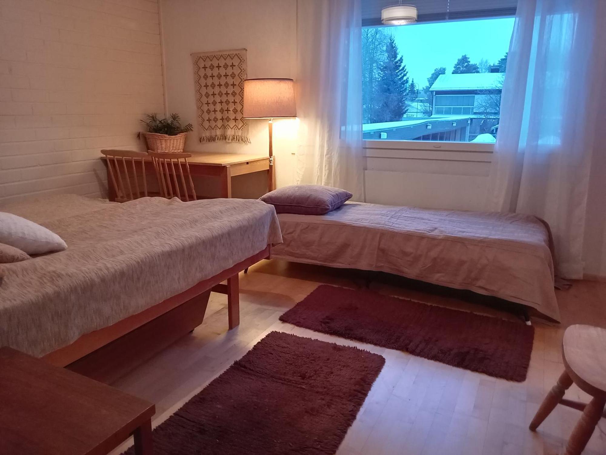 Huoneita Puusaunalla *